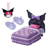 Children's bedroom set with purple bed, bat-shaped headboard, and matching accessories on a white background.