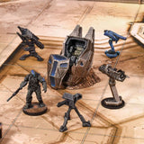 Collection of sci-fi miniature figures and models on a reflective surface