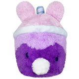 Plush toy with pink bunny ears and purple body on a white background