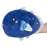 Blue plush toy with a smiling face on a white background