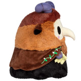 Plush toy resembling a character with brown and black fur, purple hat, and white beak on a white background