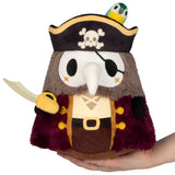 Plush toy resembling a pirate with a skull and crossbones hat, holding a sword, on a white background.