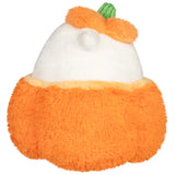 Plush toy shaped like a pumpkin with a white face and green stem on a white background