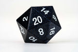 Black polyhedral dice with white numbers on a white background