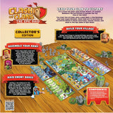 Clash of Clans board game collector's edition packaging with game components on a wooden surface.