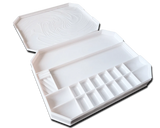 White paint palette box with compartments on a white background