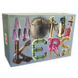 A boxed product featuring the word "monikers" spelled out with colorful illustrated objects on the front, including a pufferfish, pyramid, dolls, flamingo, catapult, and rope, on a light blue-gray background.