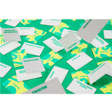 A scattered arrangement of white rectangular cards with teal text and abstract teal shapes on a bright green background.