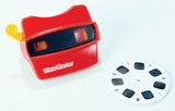 A red ViewMaster film camera with a yellow pull tab, shown next to a white viewfinder film reel on a plain white background.