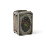 A collectible metal tin card deck box for 'Necronomicon' by LOST TINY SHIP & OUTDOOR, featuring a detailed gothic illustration of a multi-eyed creature on the front cover, set against a plain white background.