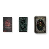 Three occult-themed boxed card decks arranged side by side on a white background: a book titled 'Aethericon' with a red pentagram cover, a black deck box with a glowing green pentagram design, and a tin titled 'Aetherwisp' with a dark multicolored creature illustration.