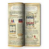 Open book with game instructions and components on a green background