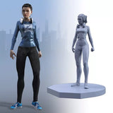 Miniature of a person in a blue and black outfit 