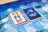 Two playing cards on a blue game board with symbols