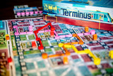 Board game with colorful pieces and 'Terminus' branding