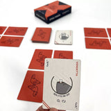 Playing cards with unique designs and text on a white background