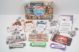 Board game components including cards and a box labeled 'Love, Career & Magic' on a white surface.