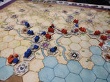 Board game with hexagonal tiles and player pieces on a map