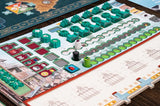 Board game with colorful tiles and pieces on a wooden table