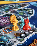 Board game pieces on a detailed game board with colorful designs