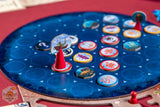 Board game with colorful tokens on a blue spinner