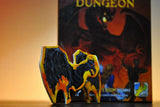 Fantasy-themed dice set with a box labeled 'Dungeon' in the background.