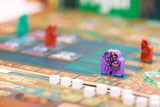 Board game with colorful pieces on a blurred background