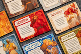 Collection of colorful game cards with various illustrations and text on a textured surface.