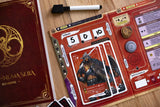 Card game with character card and rulebook on a wooden surface