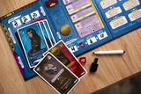 Board game cards with characters and text on a wooden table