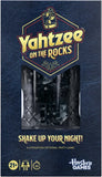 Front of the Hasbro Games 'Yahtzee on the Rocks' party game box, featuring a dark blue textured background, a central clear window showing black dice, and gold and white typography.