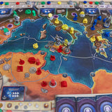 Board game with colorful pieces and a map