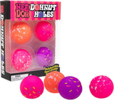 Packaged toy balls with colorful designs and 'Nee Doh' branding on a white background