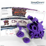 StarCraft tabletop miniatures game set with purple miniatures and game cards on a white background.