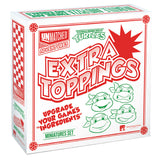 Box of 'Extra Toppings' miniatures set with cartoon turtle faces on a white background