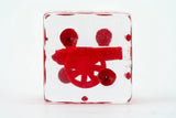 Clear block with red wheelchair symbol on a white background