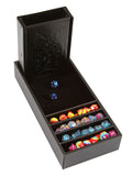 Black dice tray with compartments for dice, featuring embossed dragon design.