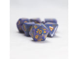 Set of blue polyhedral dice with gold numbers on a white background