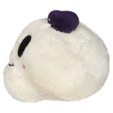 White plush toy with a purple bow on a white background