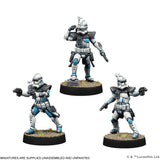 Three miniature figures of Clone Troopers from Star Wars on a white background