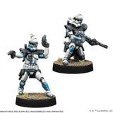 Two miniature figures of Clone Troopers from Star Wars on white background