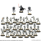 Collection of miniature figures on stands with a central figure holding a lightsaber.