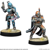 Two action figure statues on bases with a white background