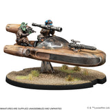 Model of a spaceship with two figures on a white background