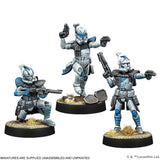 Three miniature figures in futuristic armor on a white background