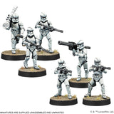 Six miniature figures of stormtroopers on round bases with a white background.