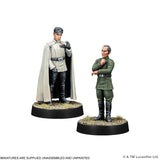 Two miniature figures on stands with a plain background