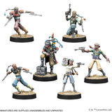 Six painted miniature figures on black bases with a white background