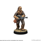 A painted tabletop miniature figurine of a furry humanoid character standing on a round black base with gravel texture, holding a blaster. The image is on a white background with small copyright and shipping text at the bottom.