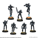Set of miniature figures on stands with a white background